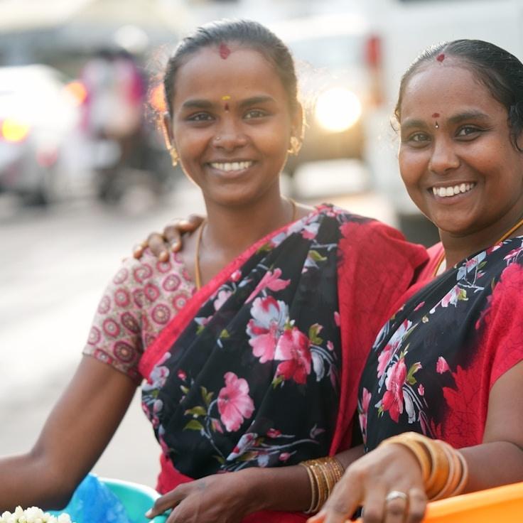 Jaya Rao, Lead Design Curator at River Pixel Studio, reviewing corporate floral arrangements